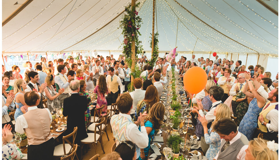Guests enjoy the speeches in the traditional pole marquee
