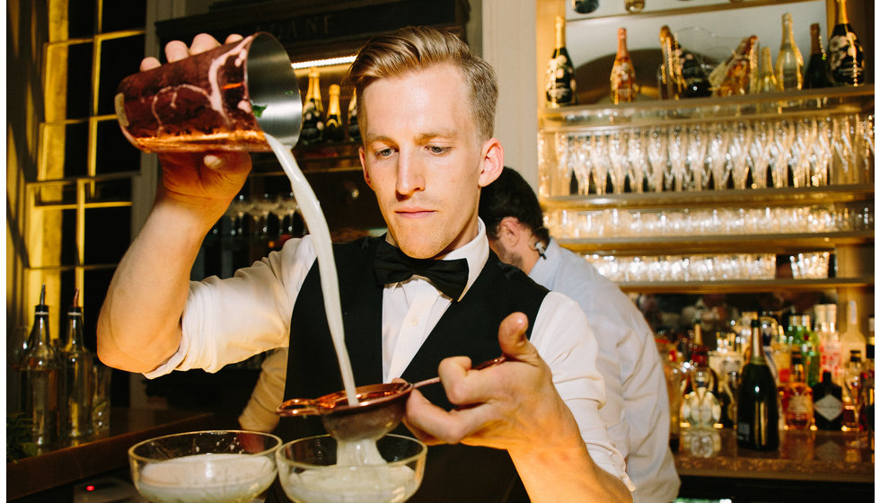 A barman from The Cocktail Service pouring a cocktail. 