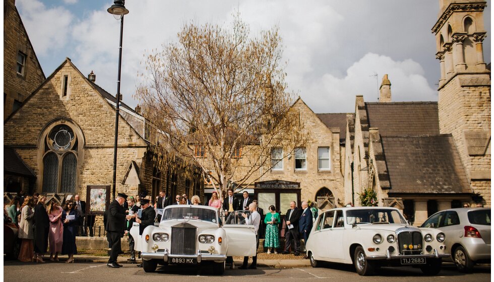 The Wedding Present Company | Vintage car wedding transport in front of the traditional English church