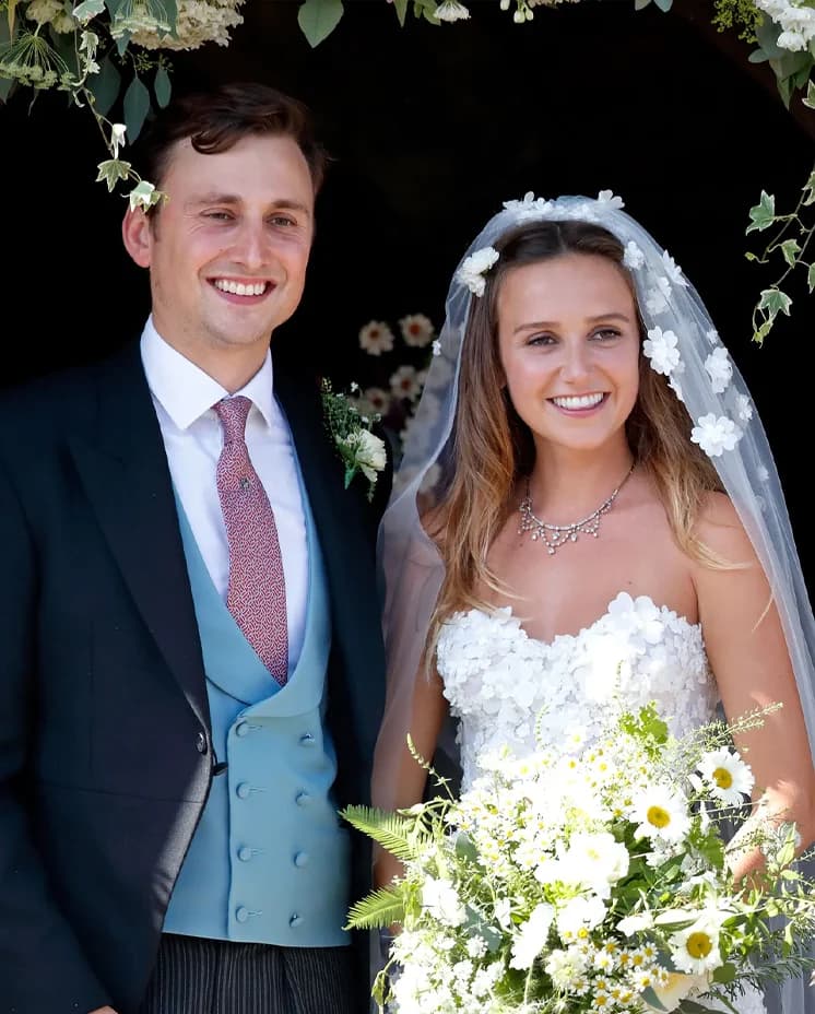 Charlie Van Straubenzee and Daisy Jenks pose outside the church