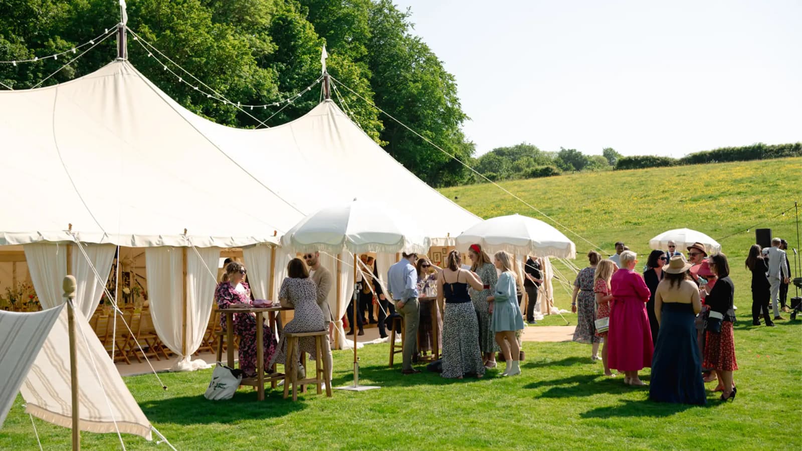 Sunny wedding day ceremony marquee