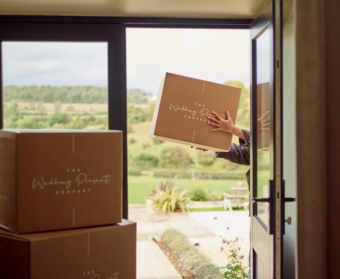A person delivers boxed wedding presents from The Wedding Present Company
