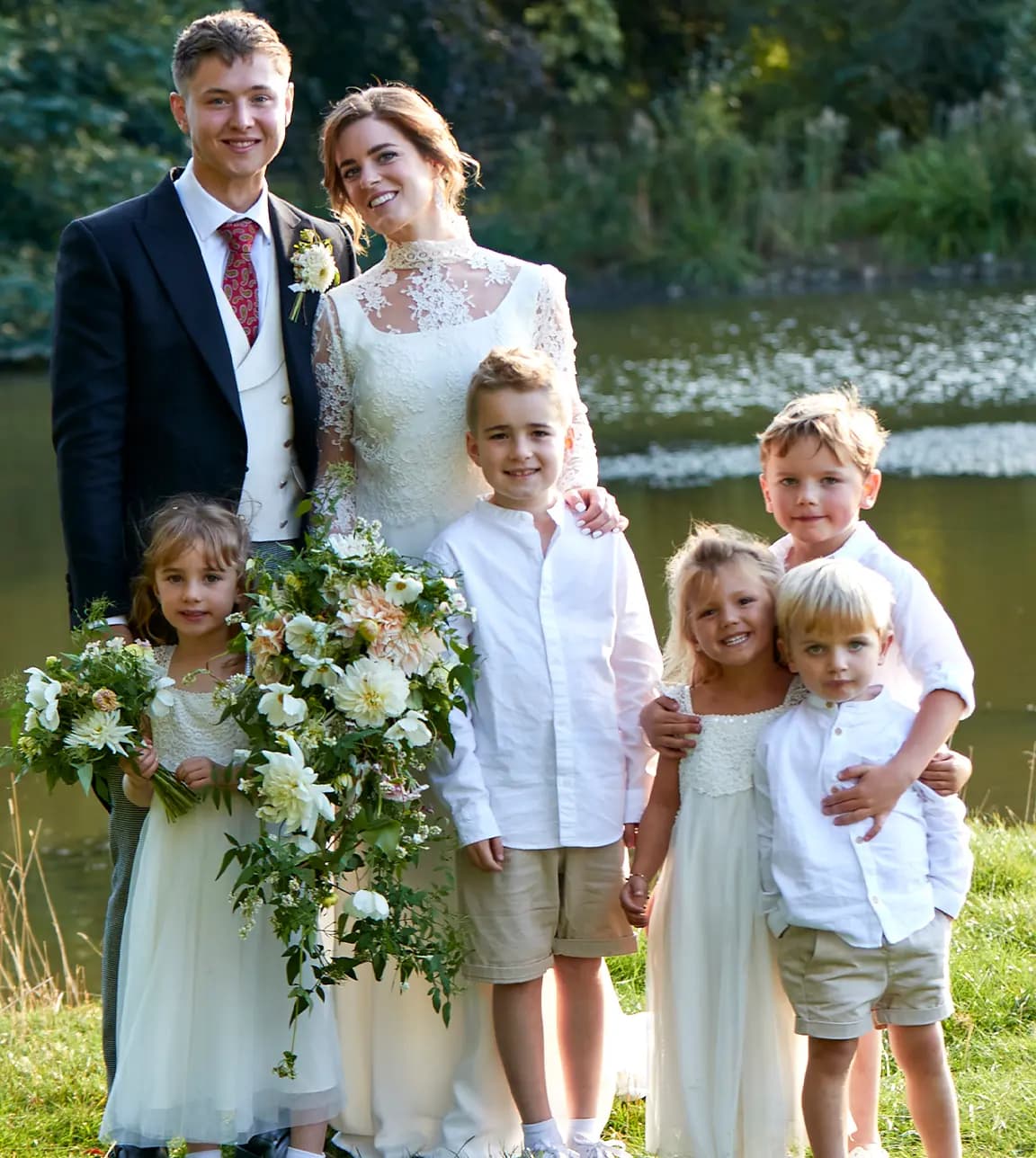 Flower girls and page boys with the bride and groom