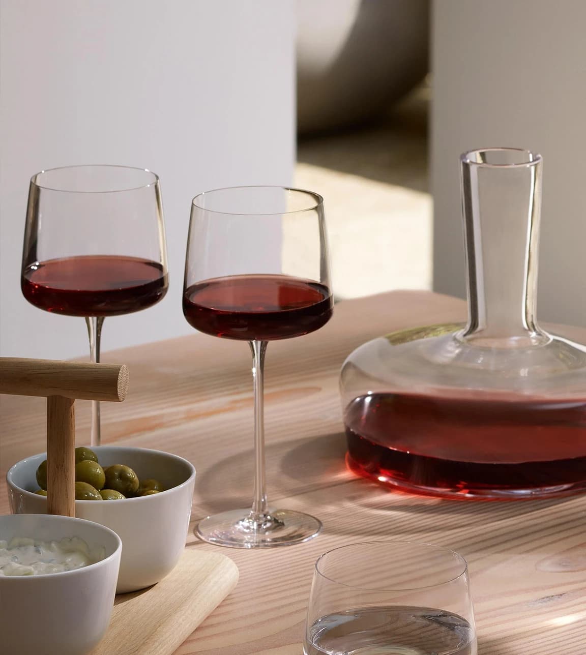 Red wine glasses and decanter with olives, perfect for your wedding gift list.