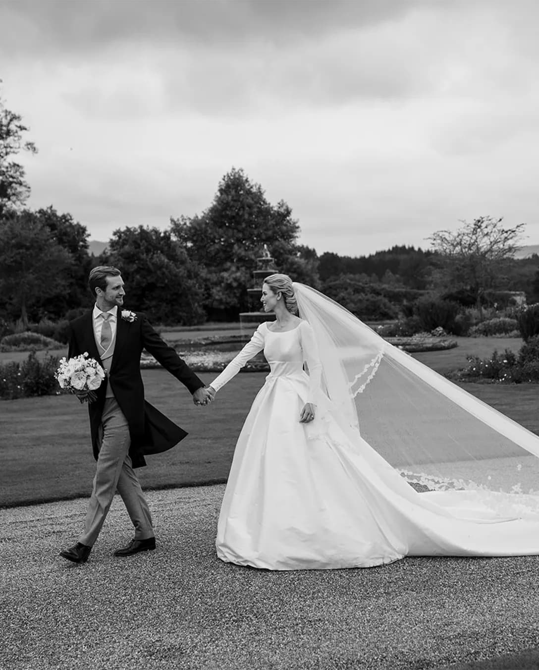Beautiful bride and groom are walking in their traditional wedding