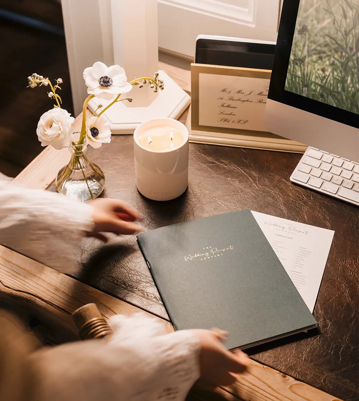 The Wedding List Advisor's hands present The Wedding Present Company brochure