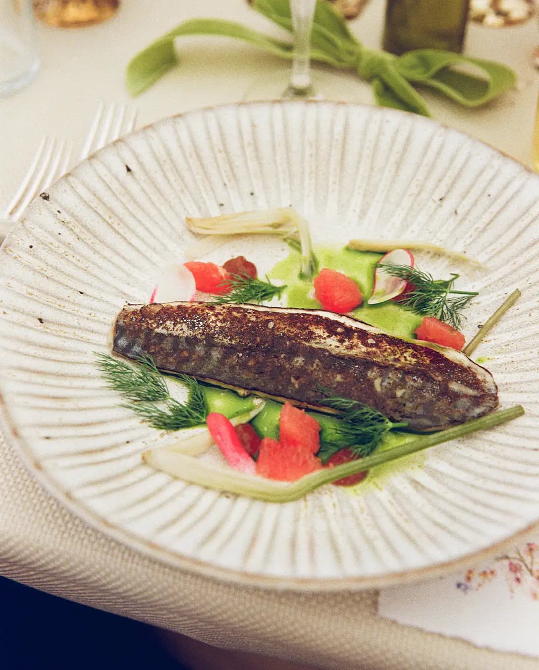 A wedding catering platter with a mackerel starter and vegetables