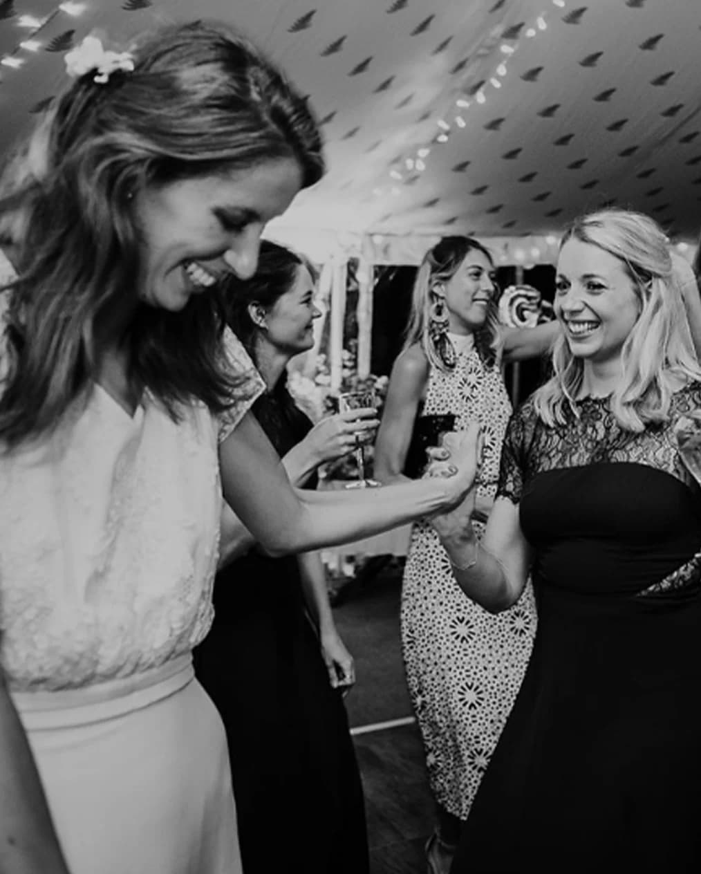 bride and her friends dancing wedding party