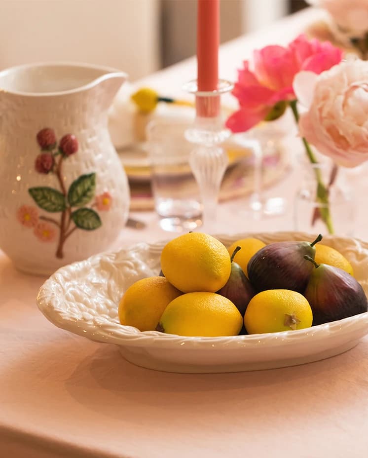 Italian inspired tablescape with embossed ceramic jug and platter with lemons