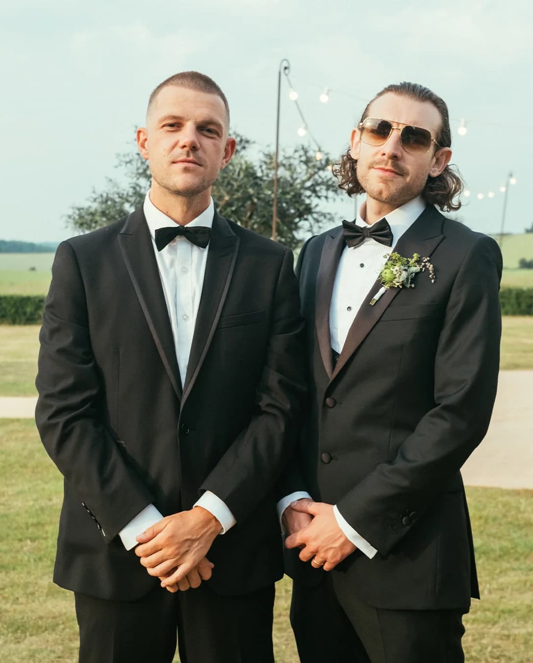 groom and groomsman wearing tuxedos and bow ties