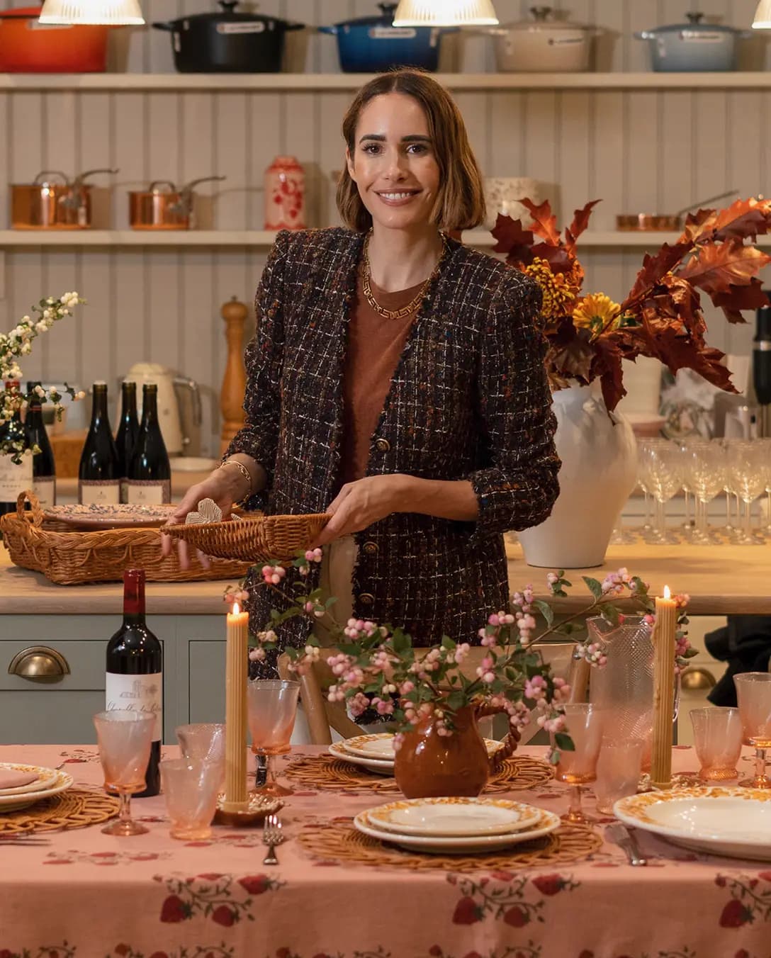 Louise Roe, the founder of Sharland England, stands in The Wedding Present Company in front of Autumn-inspired tablescape, sharing her hosting tips