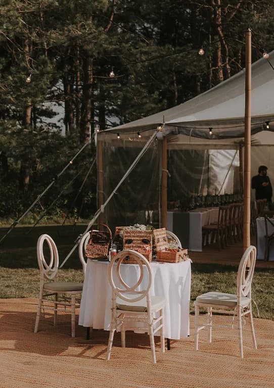 Tuscany inspired wedding décor and garden furniture outside a wedding marquee
