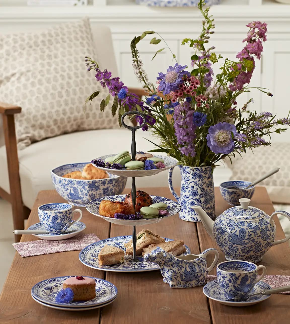 Blue ornamental tea set and cake stand are used to serve afternoon tea and desserts