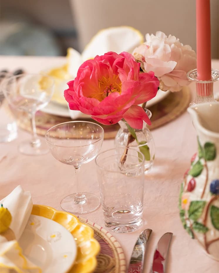 Italian inspired tablescape features delicate glassware gifts including champagne saucers on a table.