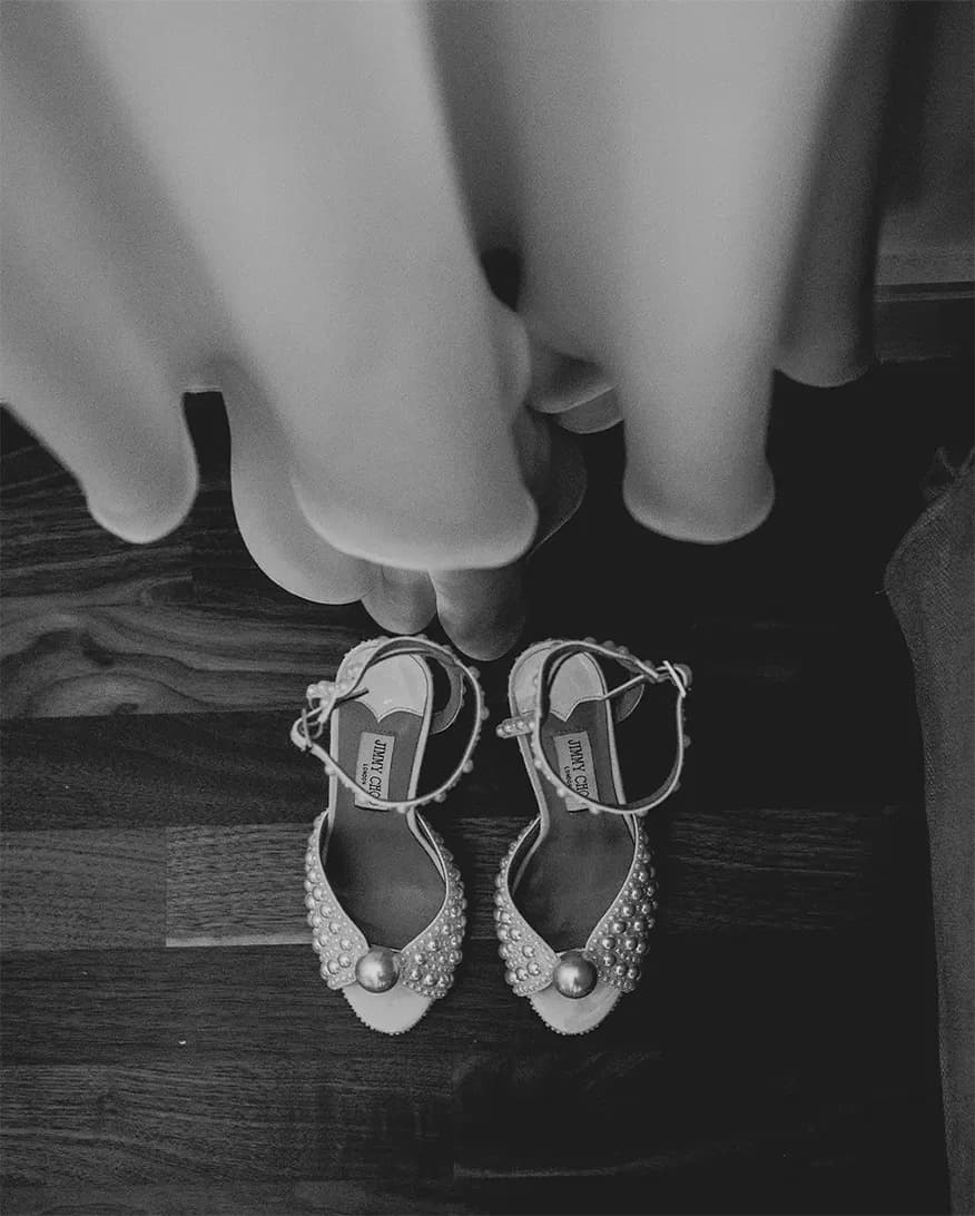 white Jimmy Choo high heels adorned with pearls for wedding