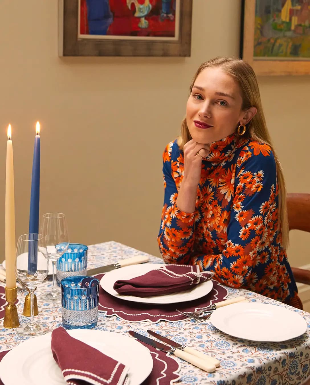 Rosalyn Wikeley sits behind the table with a cosy tablescape featuring wedding gifts form The Wedding Present Company