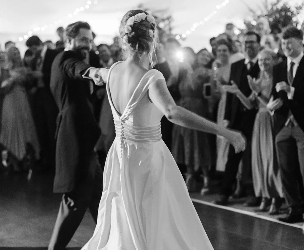 Traditional bride and groom do movie-inspired first dance in marquee.