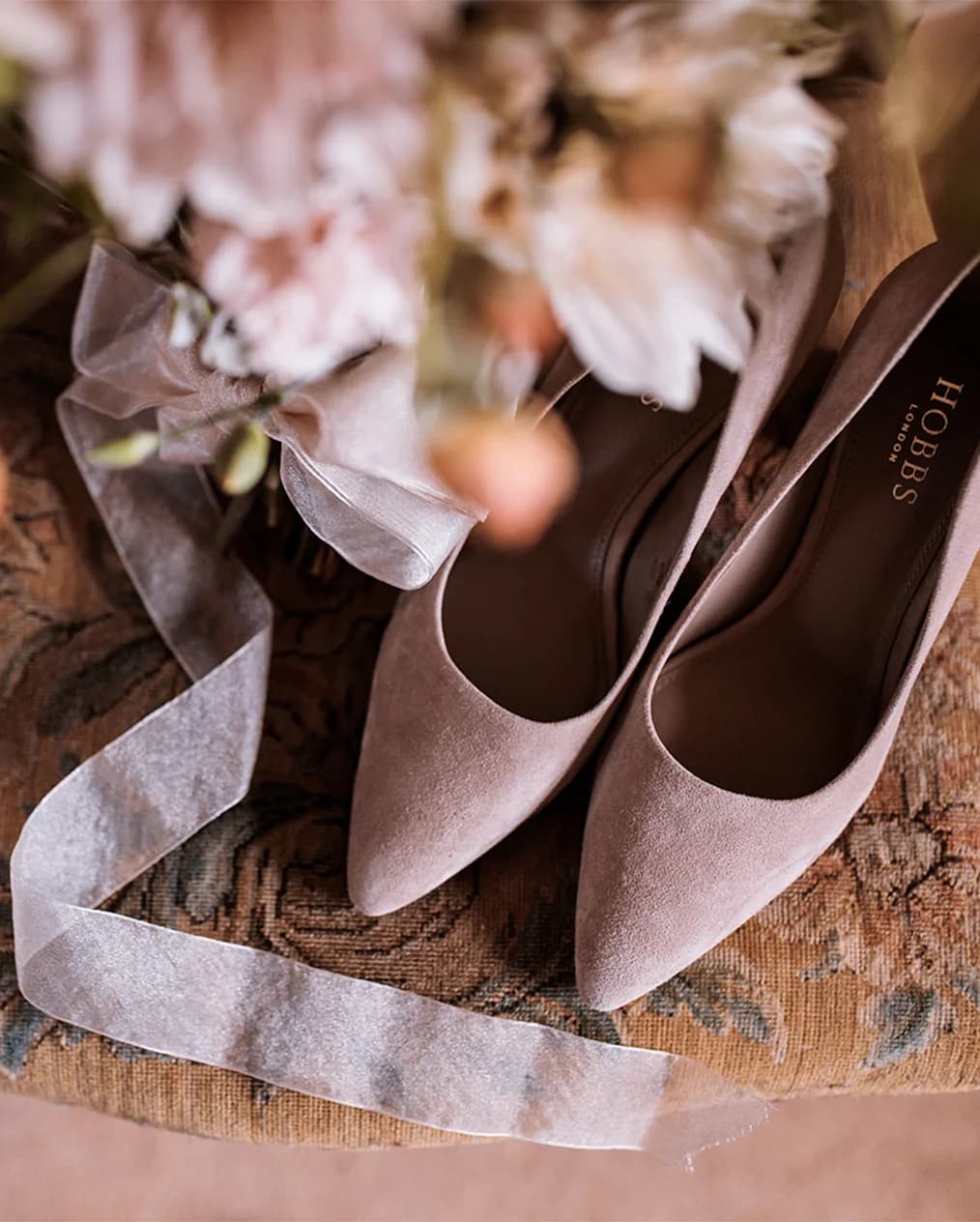 bride accessorizes wedding shoes 
