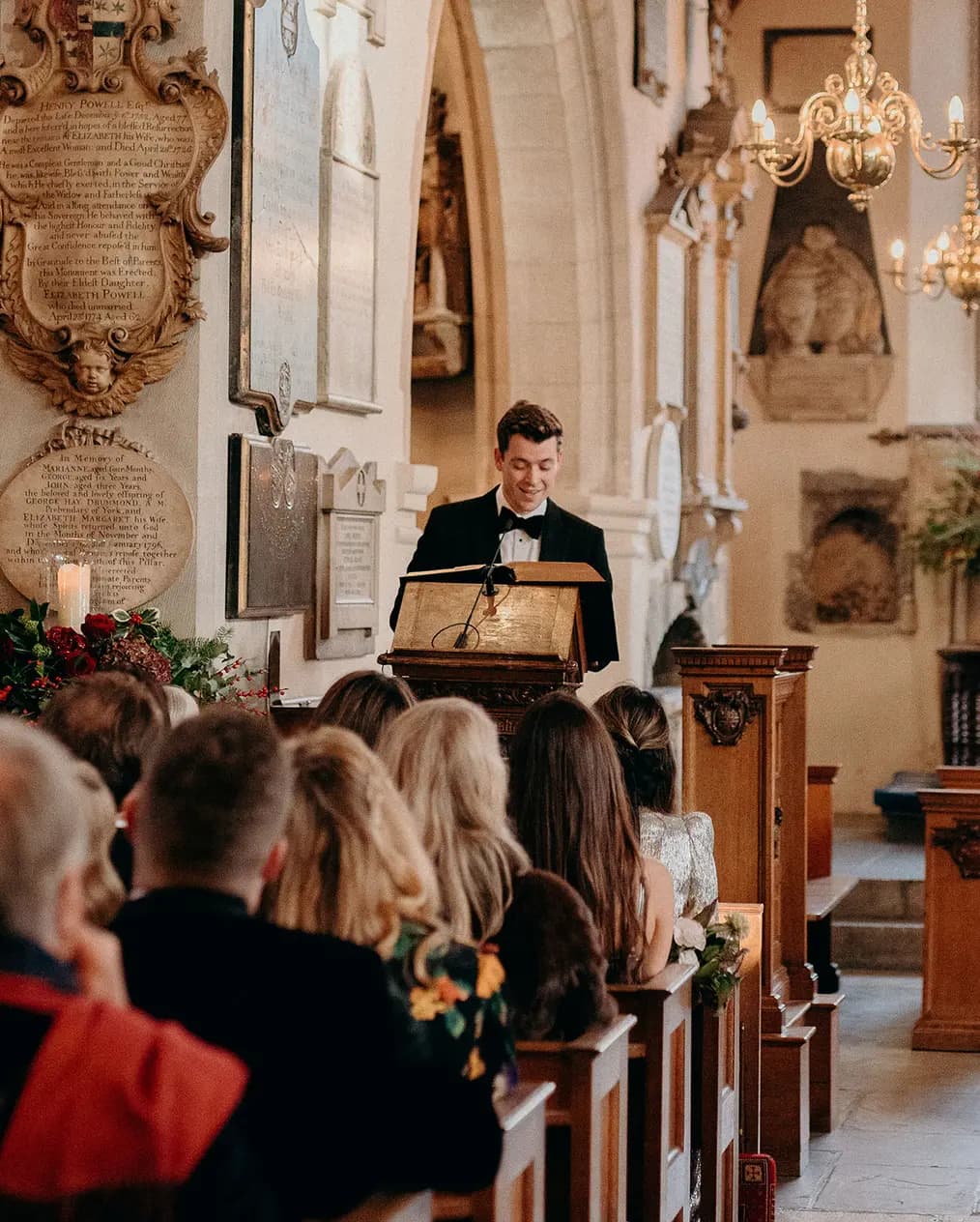 A man gives a wedding reading during his friend's wedding in church