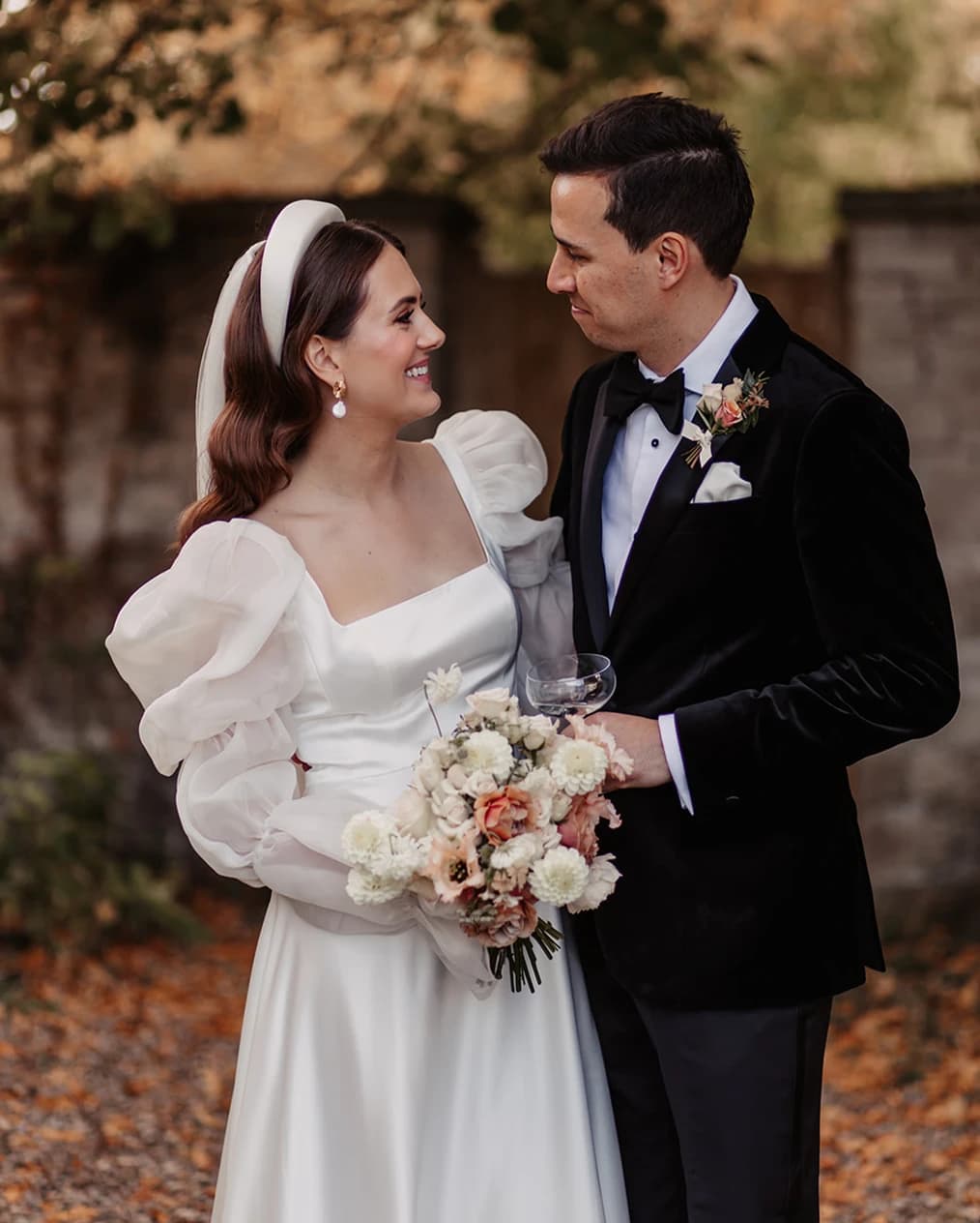 bride and groom looking at each other couple in love