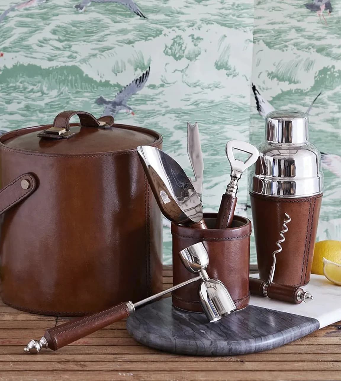 Wedding presents for cocktail lovers feature leather and stainless steel cocktail shaker and leather bar accessories