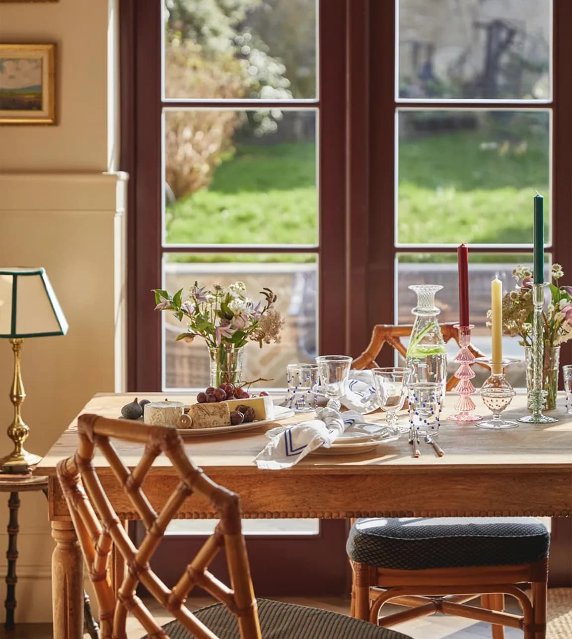 A sun lit dinning table features glassware and tableware wedding gifts from Issy Granger