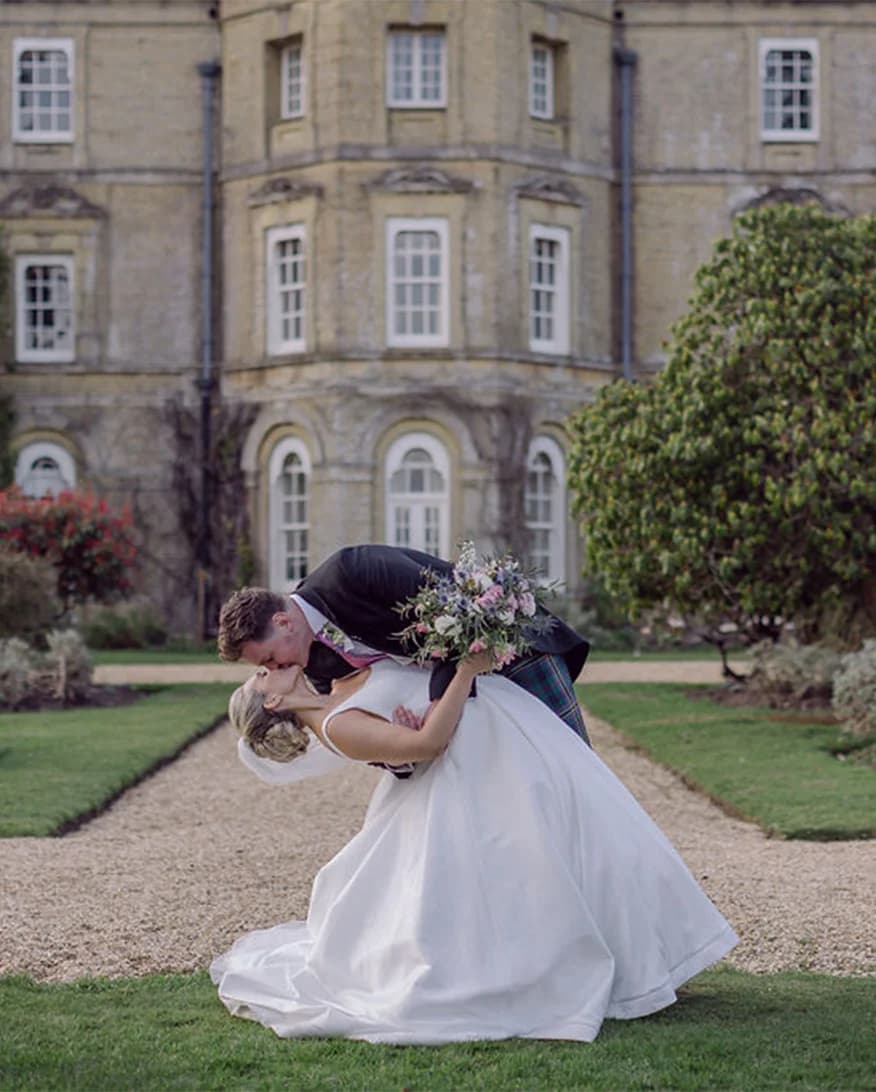 bride and groom kissing castle wedding venue location