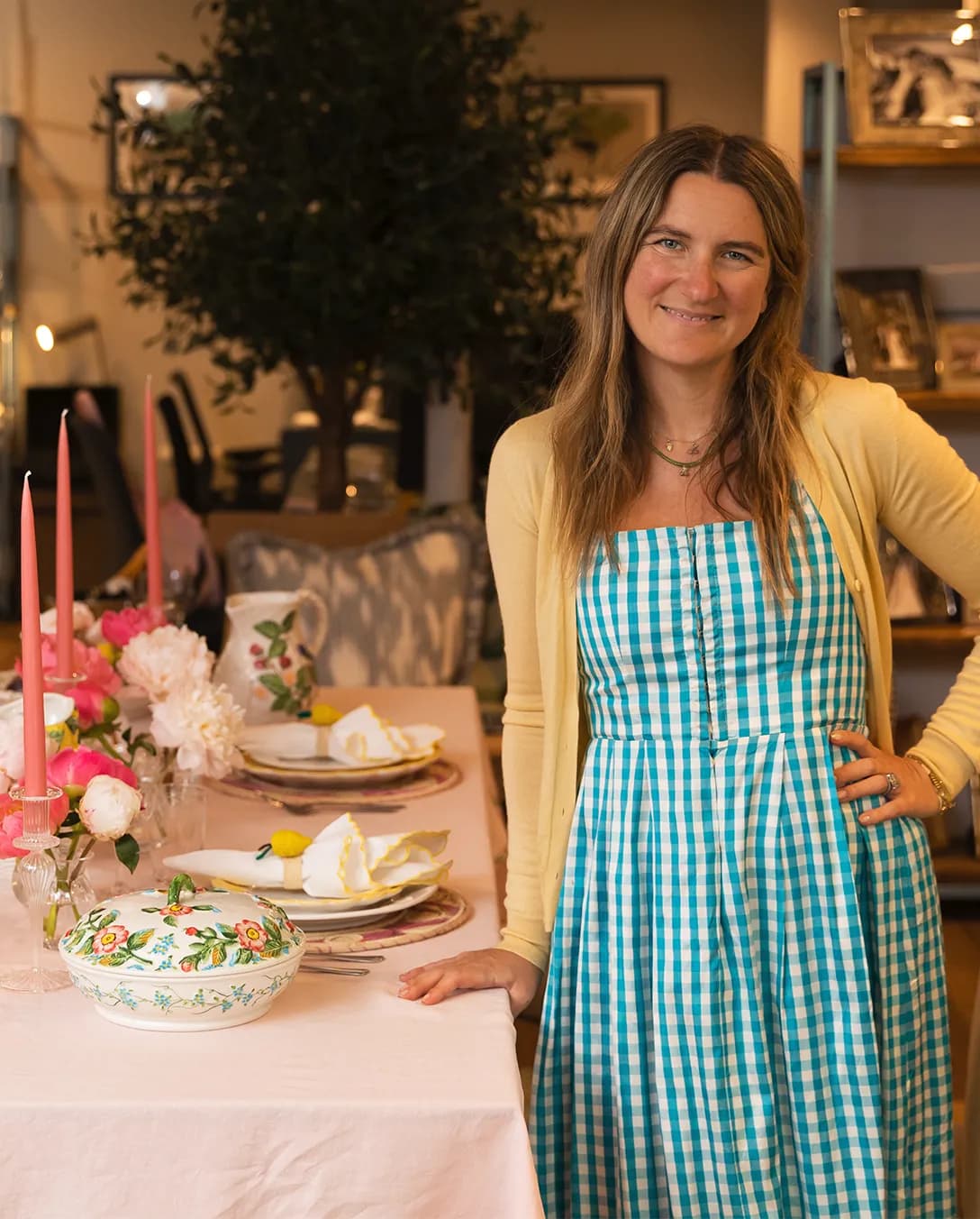 Skye McAlpine stands next to a table with Italian inspired tablescape in The Wedding Present Company Showroom