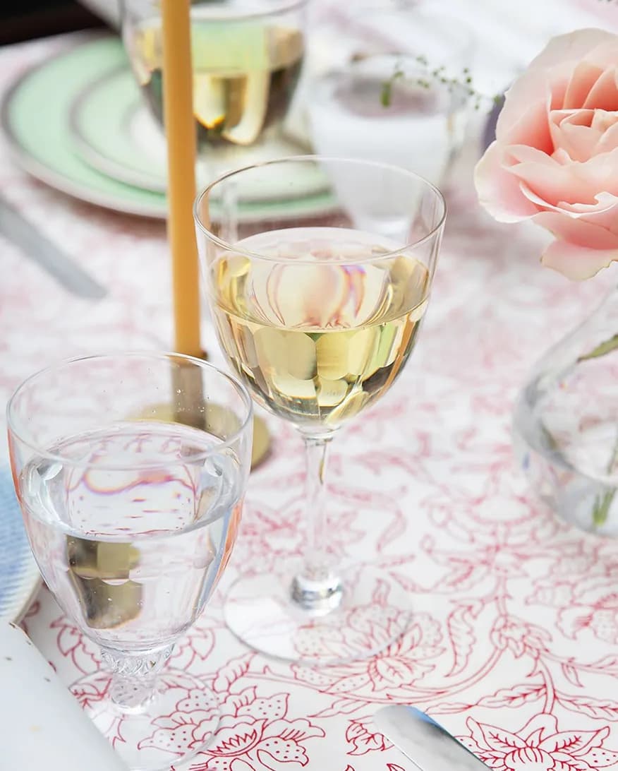 Alfresco dining with stylish crystal white wine glasses.