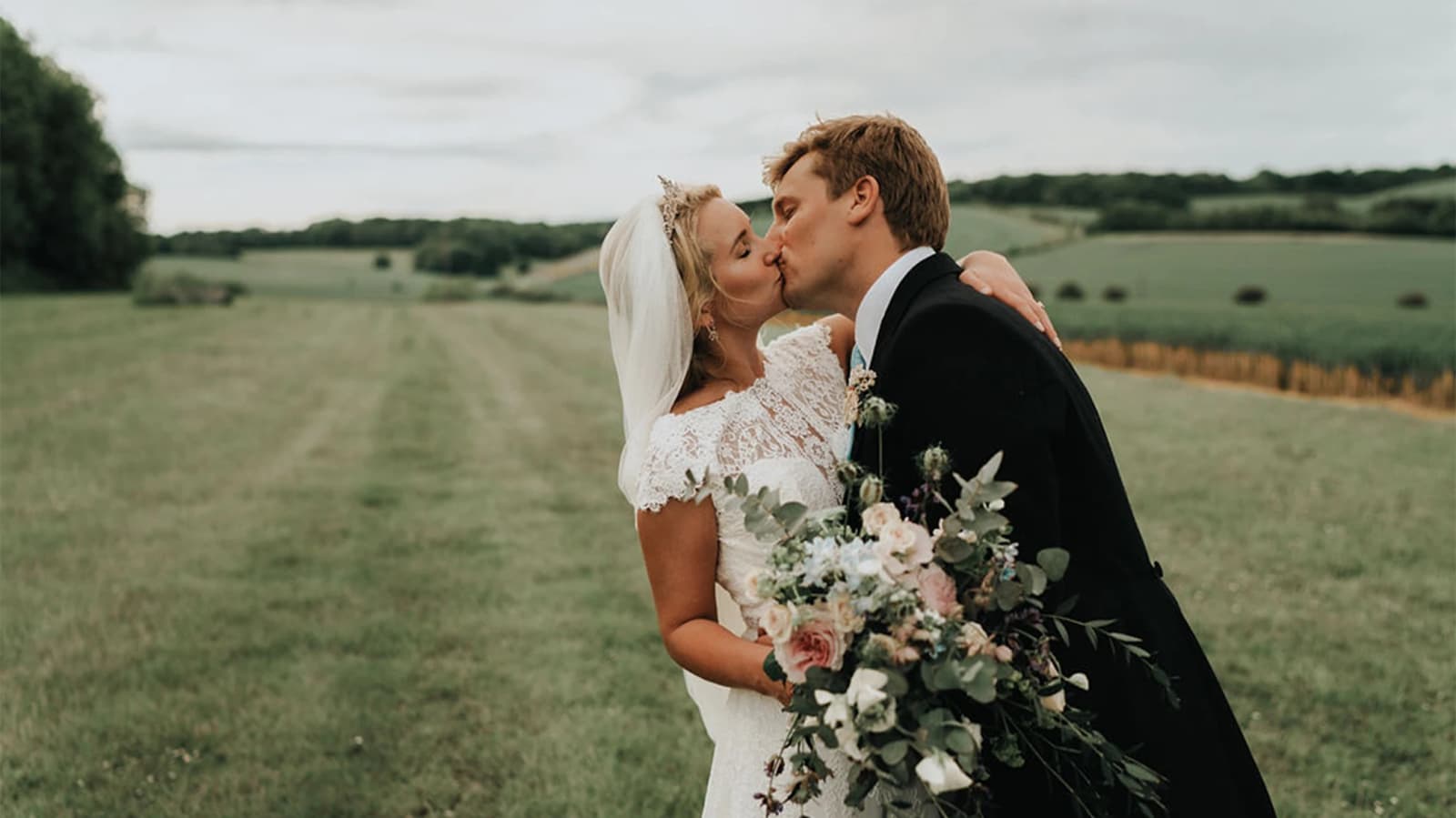 bride and groom kissing romantic moment couple wedding