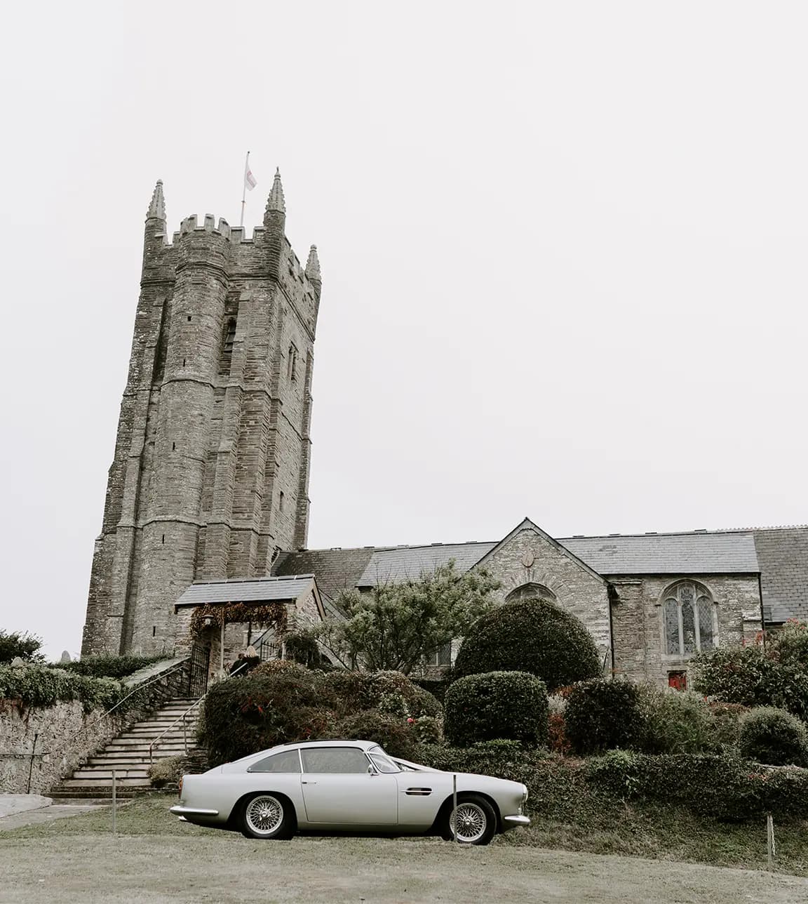 vintage wedding car in front of castle 