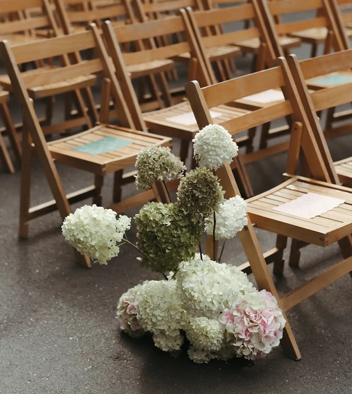 Wedding ceremony seats with colourful name placecarfs