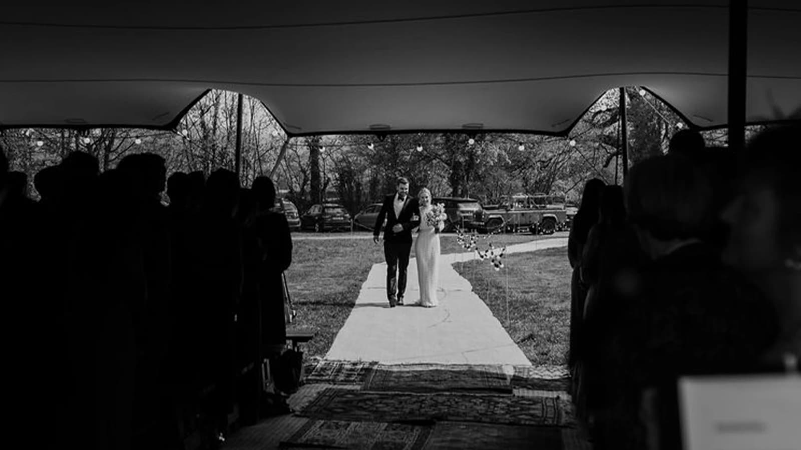 bride and groom wedding day walking down the aisle