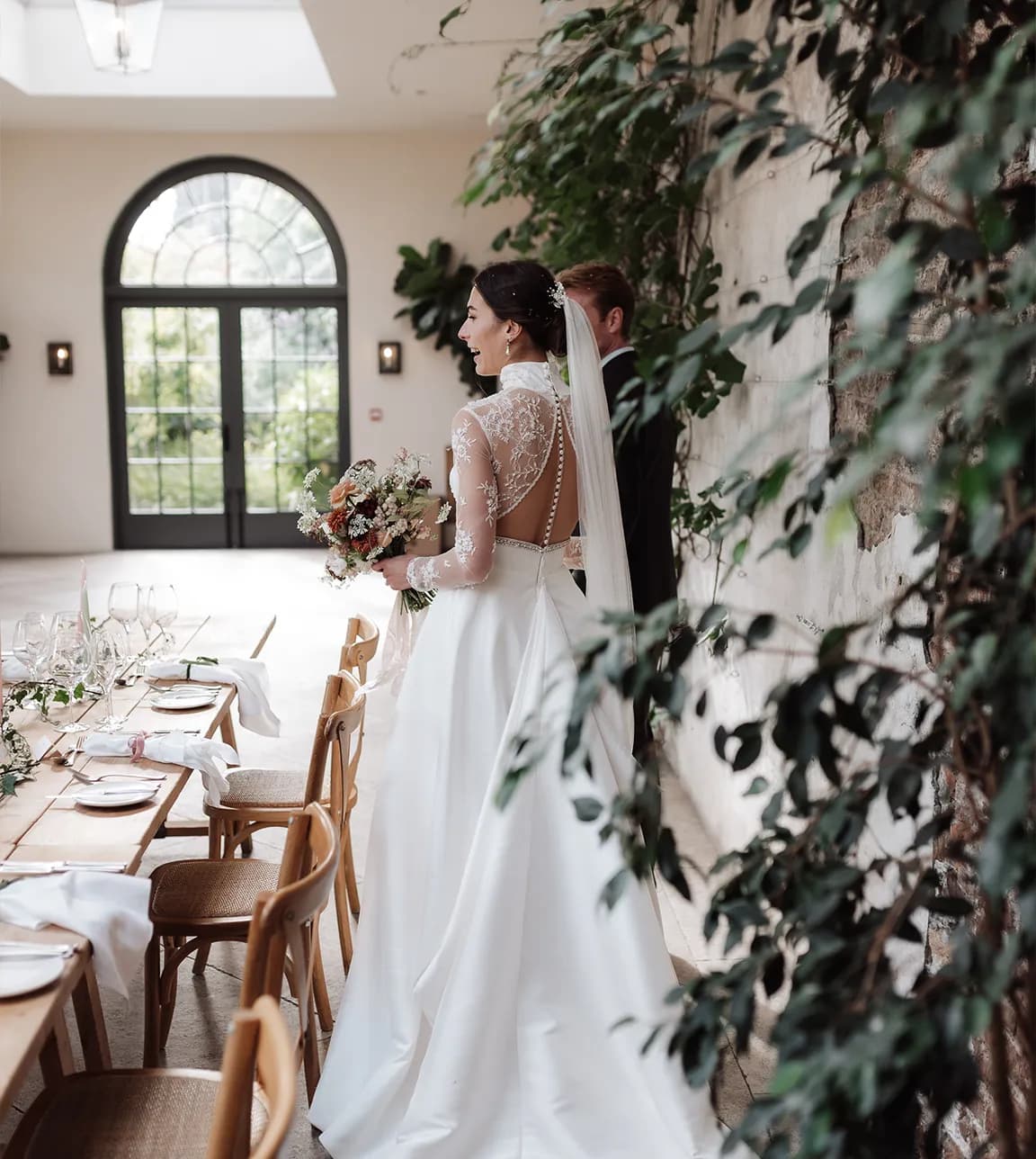 Bride and groom look at the seat arrangements of their venue