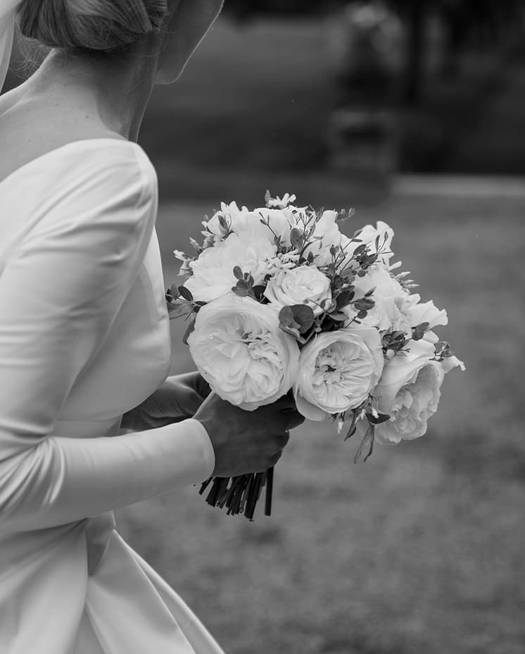 bride with her white and traditional wedding flowers close up