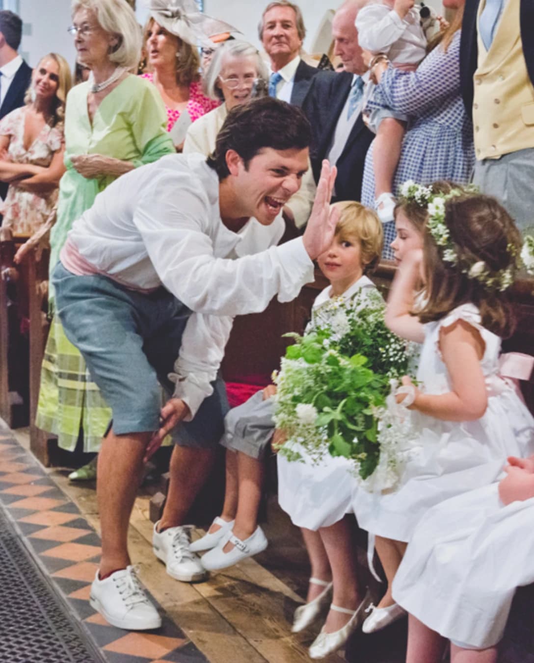 Man speaking to children on wedding day