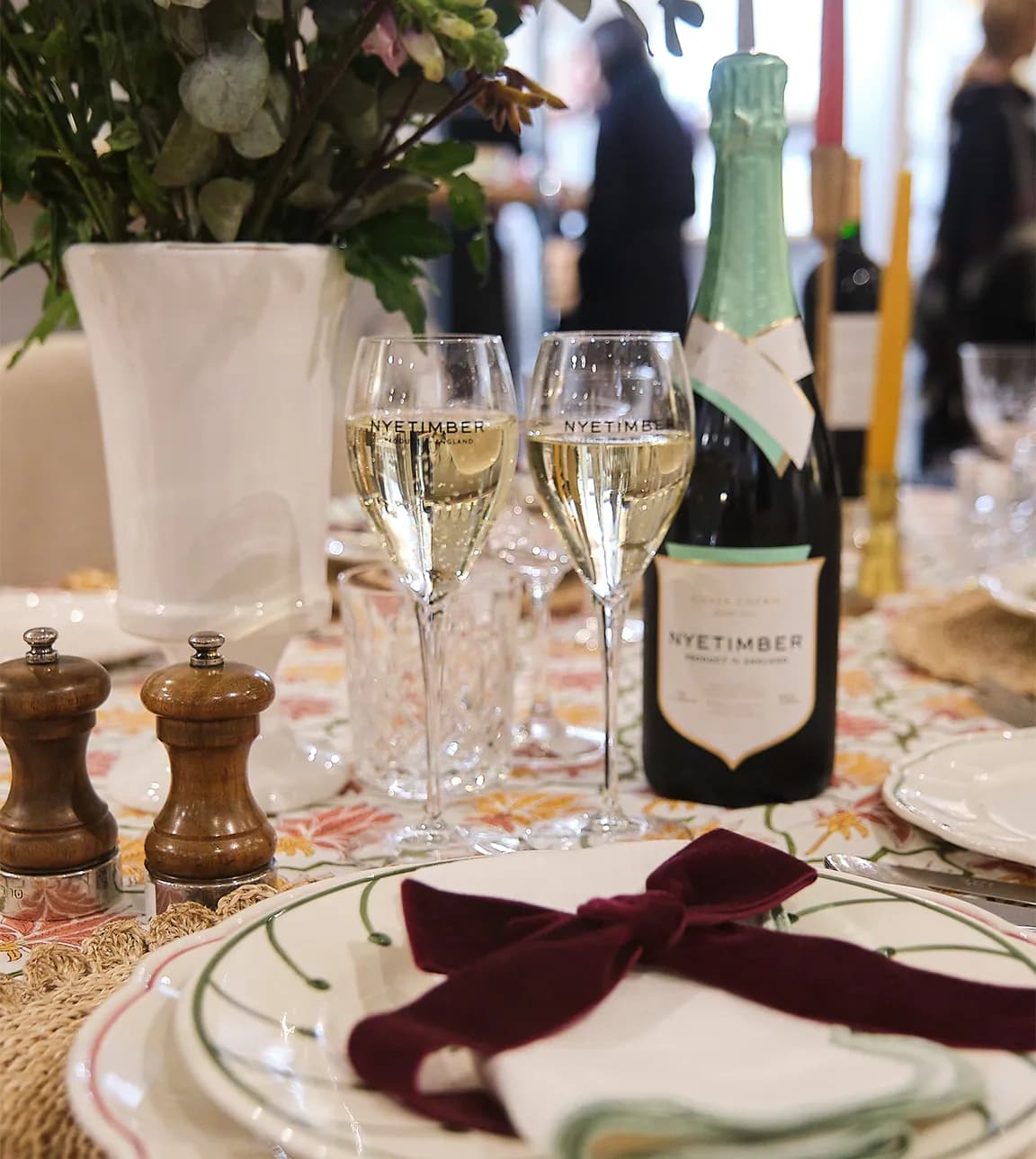 Nyetimber sparkling wine in flutes served on a beautifully decorated table at The Wedding Present Company showroom