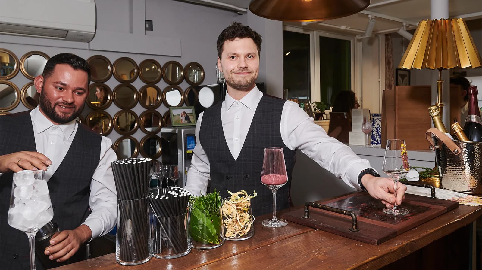 The Drunken Jockeys team serving cocktails at the bar, during The Wedding Present Company Showcase