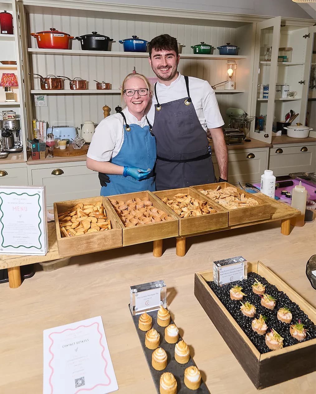 Caper & Berry wedding catering team prepares food at The Wedding Present Company showcase