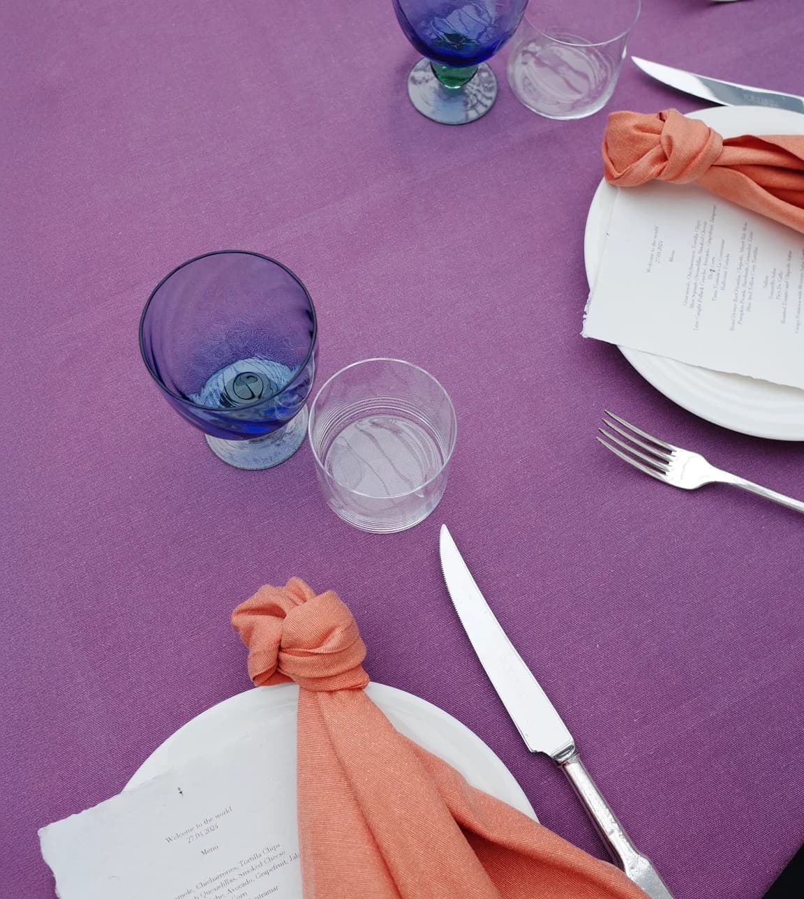 Laura Jackson's tablespace styling featuring tablecloth, napkins and glassware in mismatched colour