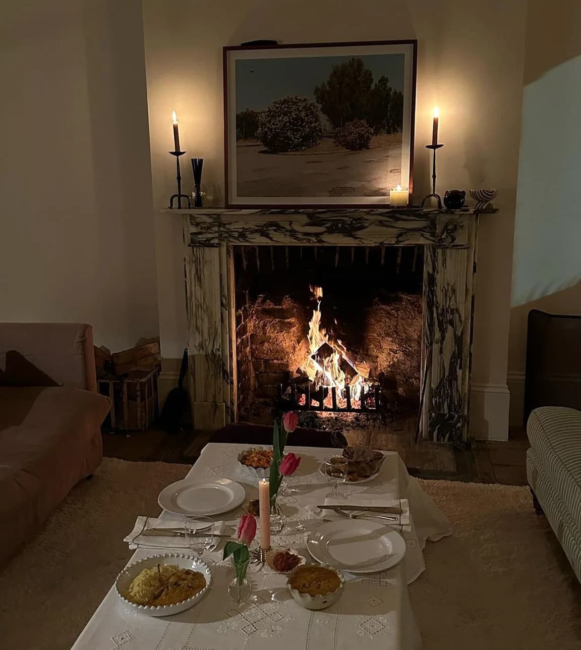 Laura Jackson's cosy living room with fireplace and unique homeware pieces