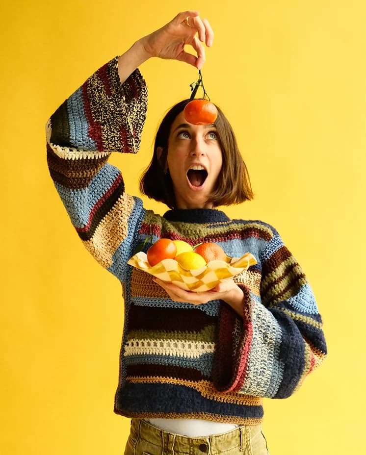 Laura Jackson holding Glassette wedding gift, a checkered bowl with fruit