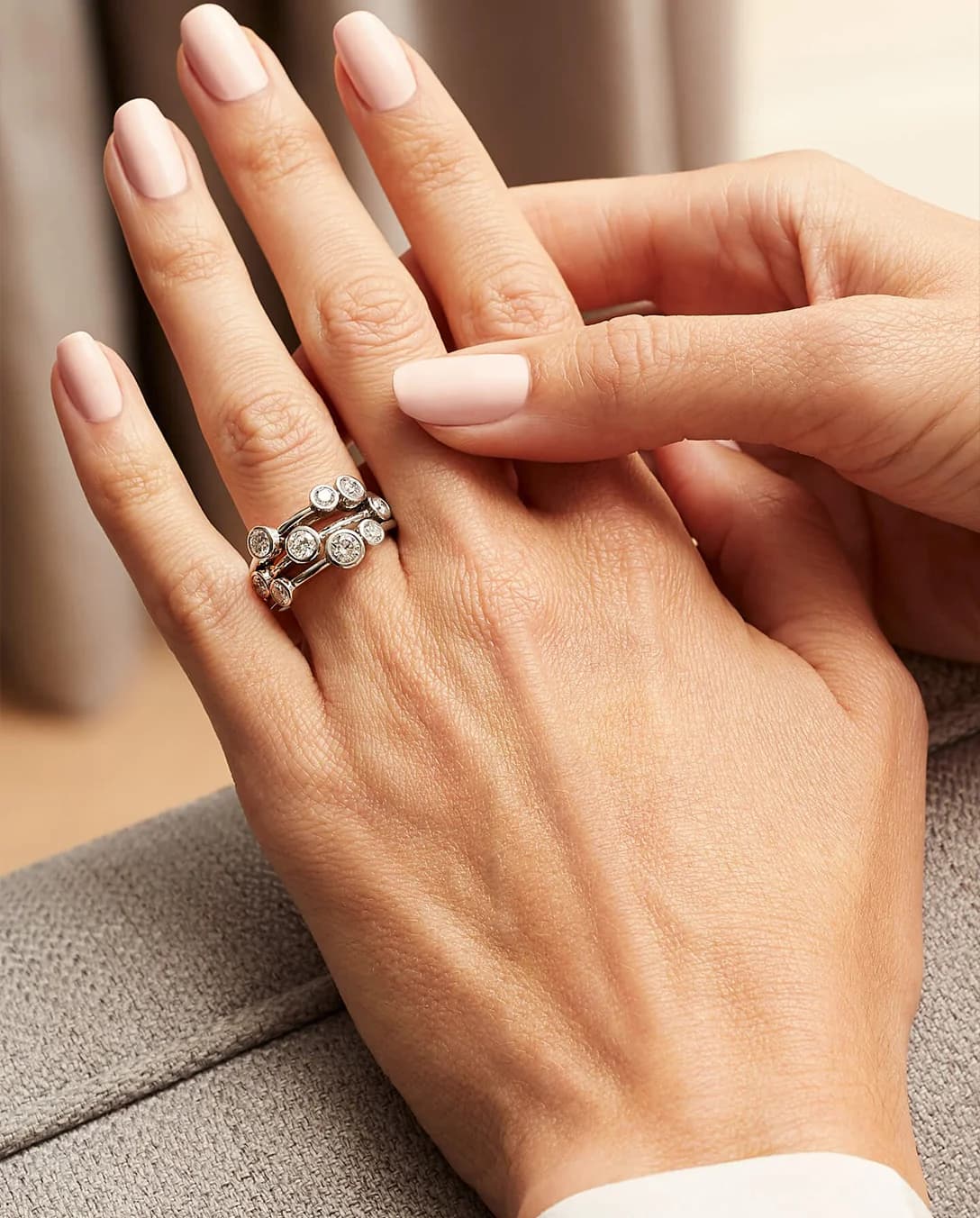 A hand with Boodles Raindance classic platinum diamond ring