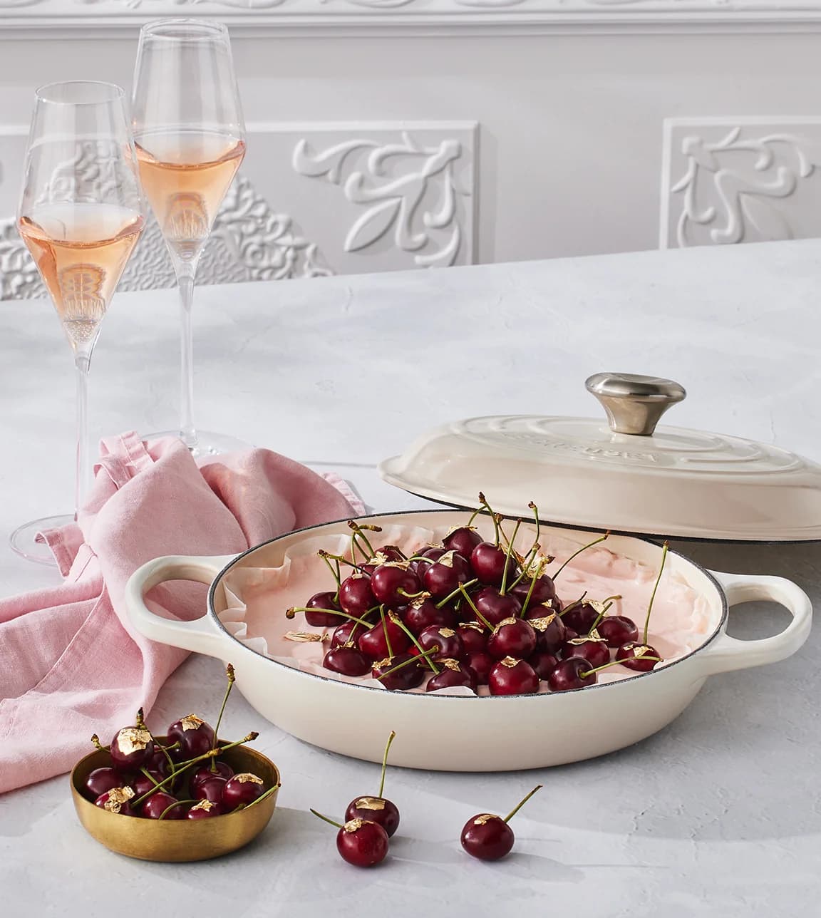 Le Creuset recipe for June featuring vanilla cheesecake with cherries served Le Creuset shallow casserole