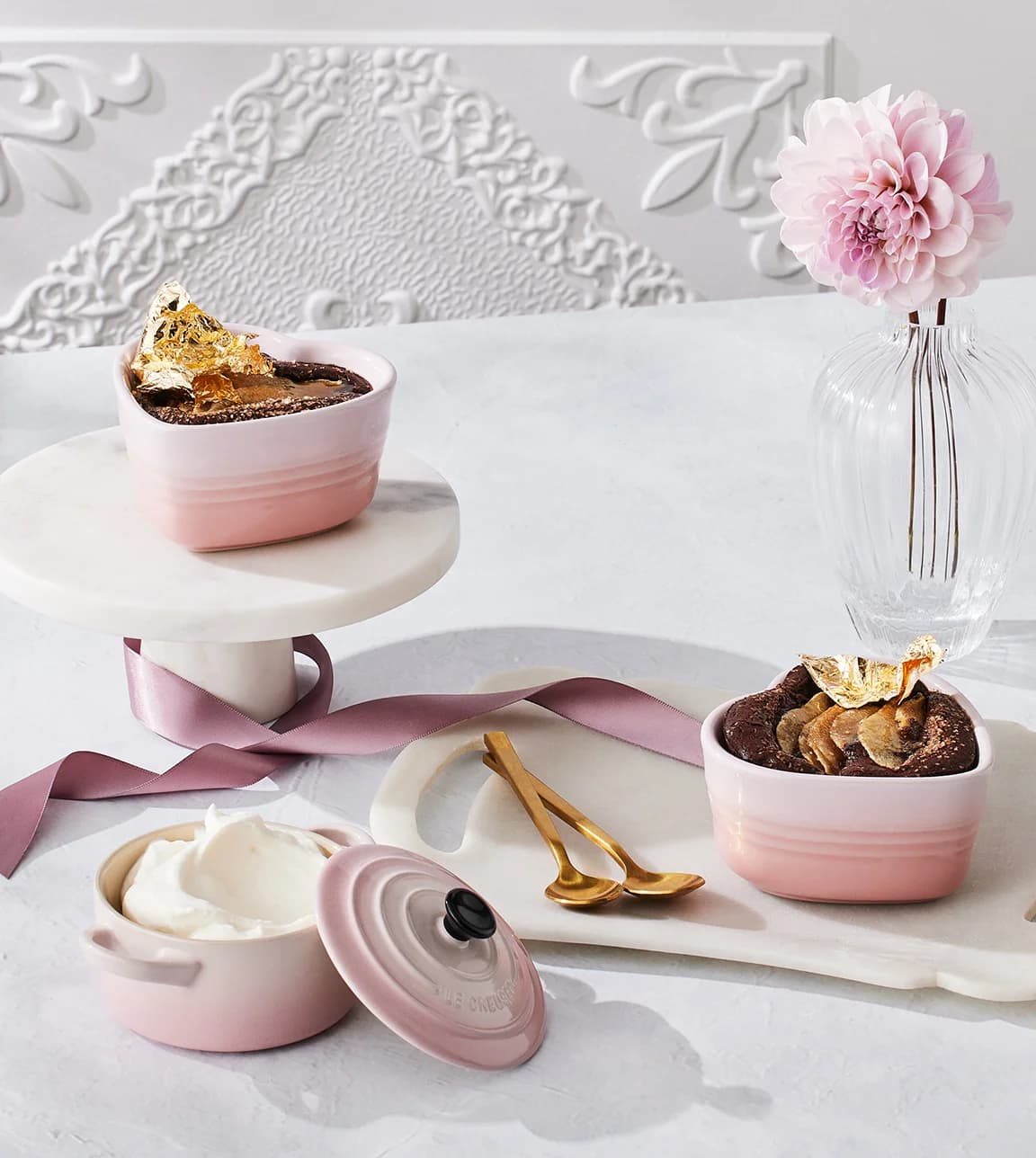 Le Creuset recipe for february featuring pear and chocolate heart shaped puddings with Amaretto cream in Le Creuset heart stoneware