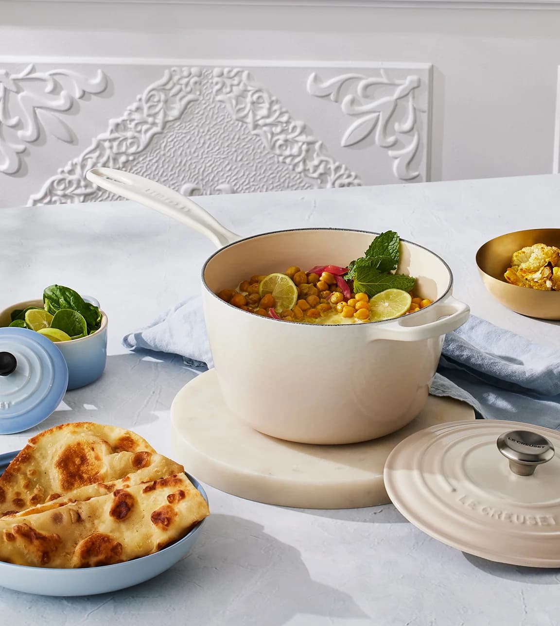 Le Creuset recipe for march featuring kale & chickpea curry served in Le Creuset saucepan