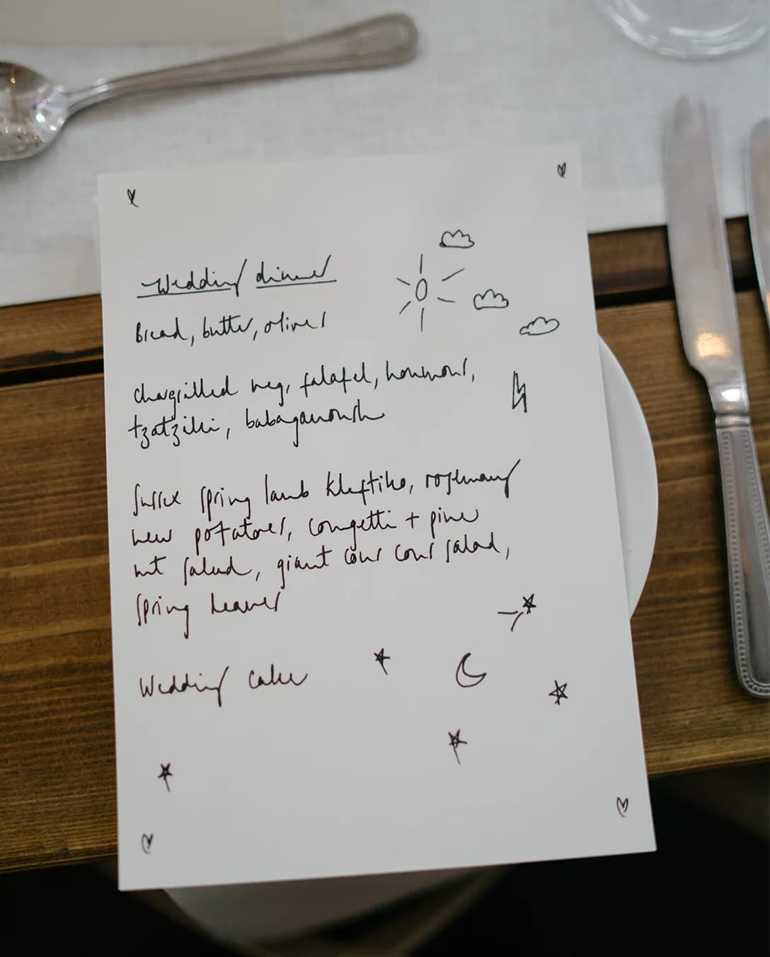 A handwritten wedding menu showing the catering options served at the wedding