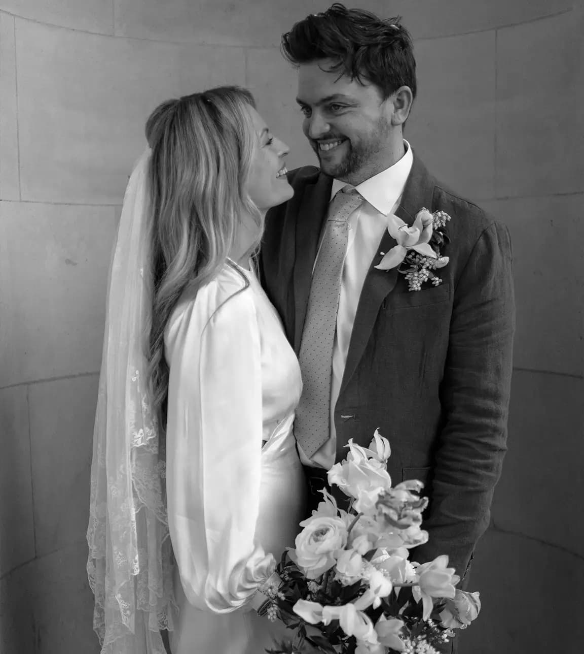 Bride and groom are looking at each other 