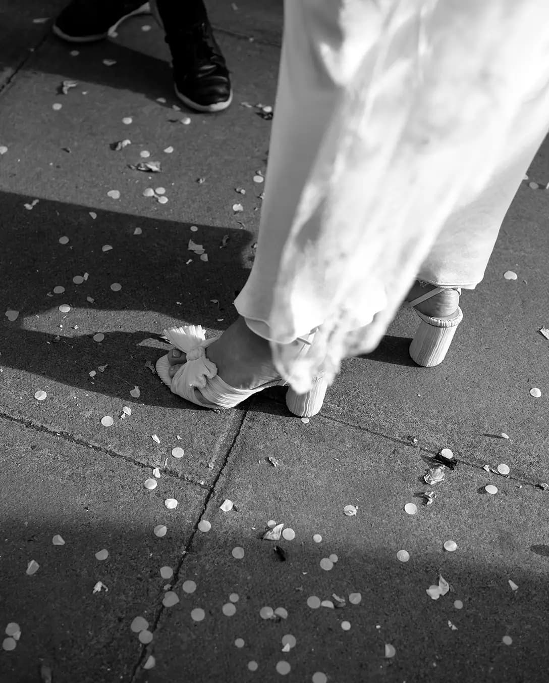 Loeffler Randall bridal shoes with confetti on the pavement