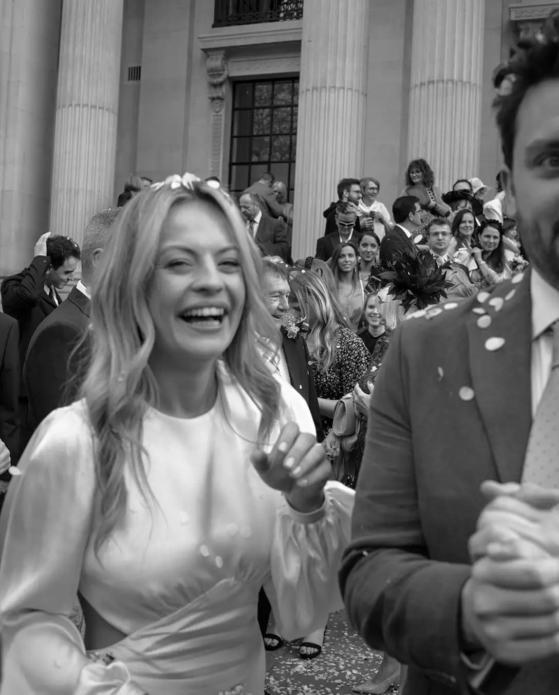 Newlyweds are full of joy after their wedding ceremony at Marylebone Town Hall